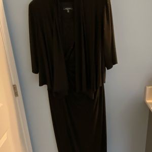 Black floor length dress.  Sleeveless with jacket